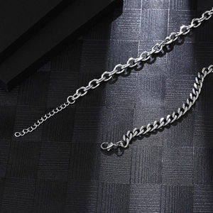 Detail view of dual-style titanium steel chain with lobster clasp and extension links