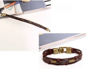 Close-up of multi-layer braided leather bracelet with vintage bronze charms and metal clasp