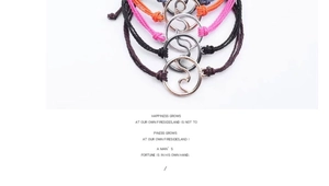 Detail of five colorful wax string bracelets with wave charms and adjustable knots