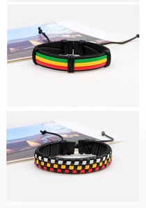 Detail of multi-layered braided leather bracelets with colorful ethnic patterns and adjustable cords