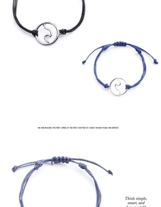 Detail of adjustable handmade wax string bracelets with circular wave charm pendants