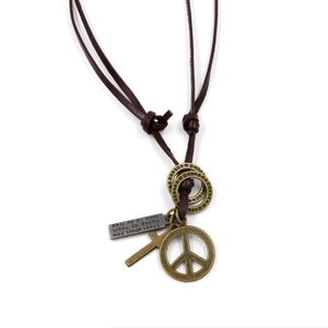 Vintage leather necklace with bronze peace sign and cross pendants on white background