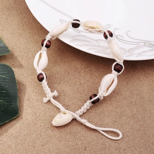 Bohemian seashell and wood bead anklet handmade with white cotton cord for summer beach