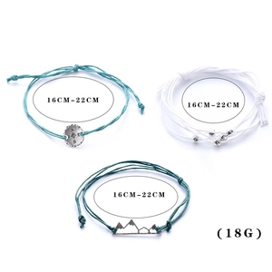 Three-piece set of woven cord bracelets with compass and mountain pendants for women