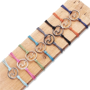 Handmade waterproof wave charm bracelets set with braided cords in eight vibrant colors