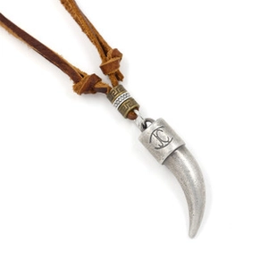 Detail of leather cord necklace with vintage silver horn pendant and Greek key bead