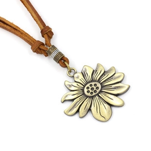 Detail of vintage sunflower pendant on leather cord with bronze bead accents