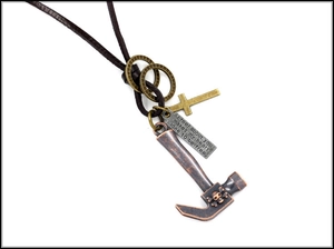 Detail of retro punk leather necklace with alloy hammer pendant and engraved metal tag