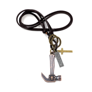 Punk leather cord necklace with vintage bronze hammer and skull charms on white background