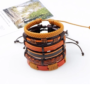 Set of six handmade woven leather bracelets with adjustable pull-string in warm earth tones