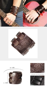 Detailed macro view of the vintage wide leather bracelet with embossed scorpion pattern