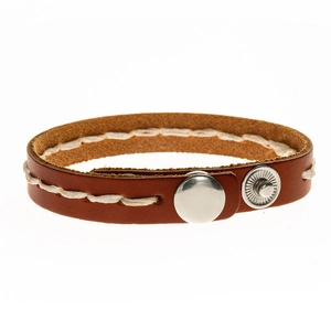 Detail of handcrafted brown leather bracelet with white stitching and silver snap buttons