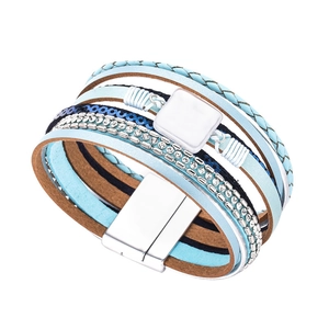 Close-up of bohemian multilayer leather bracelet with blue straps and rhinestone detailing