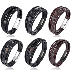 Detailed view of six braided leather bracelets with metallic magnetic clasps for men