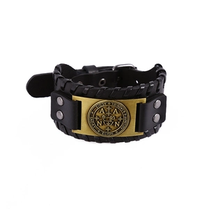 Vintage black leather cuff bracelet with bronze oracle plate and woven edge detailing