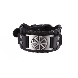 Punk style wide black leather bracelet with Slavic Kolovrat sun wheel metal plaque