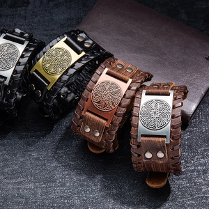 Handmade leather bracelets with Viking Celtic knot metal plates in black and brown colors