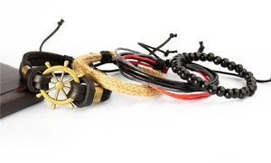 Set bracciale multistrato nautico con timone in ottone e cordini in pelle intrecciata