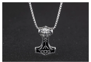 Detail of Mjolnir pendant with Nordic runes and stainless steel box chain necklace