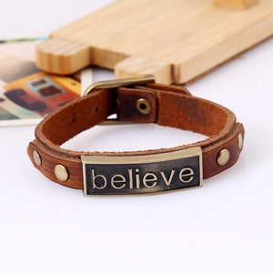 Vintage brown leather bracelet with believe metal plate and adjustable belt buckle closure