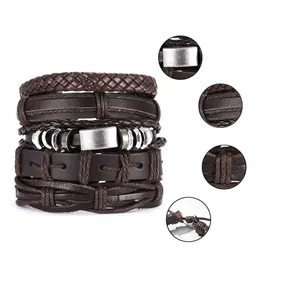 Macro details of brown braided leather bracelets with silver alloy buckles and texture