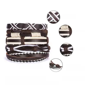 Detail of multi-layer leather bracelets showing brown braided cords and adjustable knots