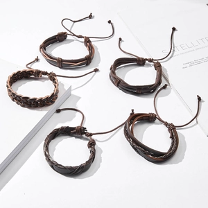 Close-up of vintage brown braided leather bracelets with adjustable sliding knots