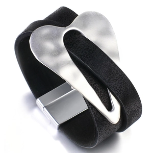 Minimalist wide black leather bracelet with large silver heart charm and magnetic clasp
