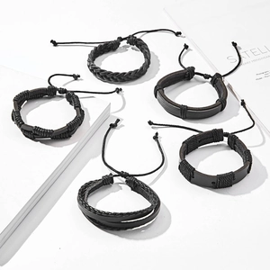 Detail of 5-piece black leather woven bracelet set with adjustable drawstring closures