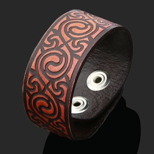 Handmade vintage wide leather bracelet with Celtic spiral pattern and snap buttons