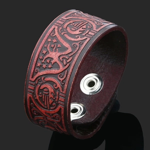 Handmade vintage Viking leather bracelet for men featuring red Celtic embossed patterns
