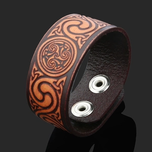 Retro wide leather bracelet with Celtic Triskelion spiral embossing and silver snaps