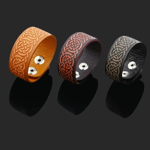 Set of three vintage punk leather bracelets with embossed Celtic knot and metal snaps