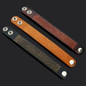 Handmade punk leather bracelet with celtic knot embossing and adjustable silver snap button