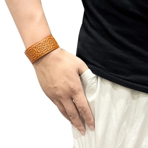 Men's vintage brown leather wide bracelet with embossed Celtic knot pattern