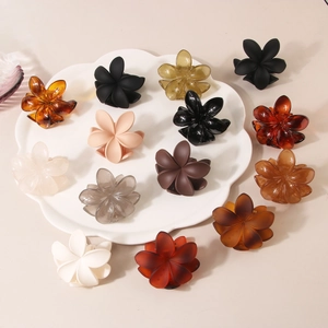 Matte and glossy frangipani flower hair claws set in various colors for women