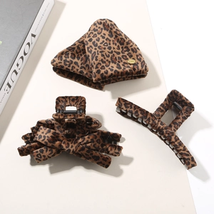 Three-piece leopard print hair claw clips and headband set for women on Vogue magazine