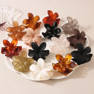 Set of 14 colorful plumeria flower hair claws in matte and glossy finishes for women