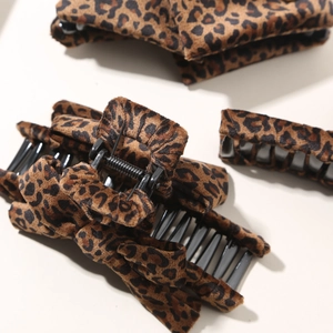 Classic leopard print hair claw clips with soft velvet texture for women's hairstyles