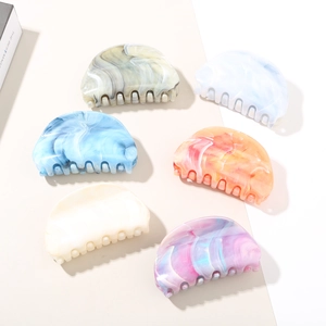 Set of six marble texture claw clips in various colors for elegant hair styling