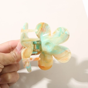 Gradient floral hair claw clip with colorful marble texture and golden metal spring