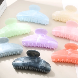 Elegant semi-round shell acetate hair claws set in various pastel marble colors for women