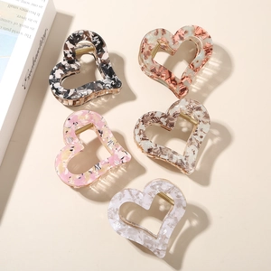 Elegant floral acetate heart hair claws in five marble and floral pattern finishes