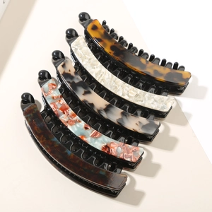 Detailed set of 5 acetate banana hair clips with leopard and marble patterns