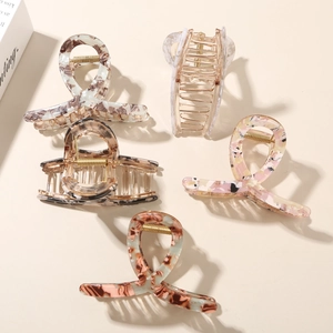 Set of floral acetate hair claws with strong metal springs in marble and tortoiseshell patterns