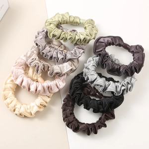 Close-up of 9-color satin pleated scrunchies set made of high-quality imitation silk fabric