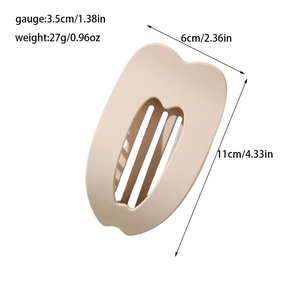 Flat beige hair claw clip with heart hollow design and size dimensions on white background