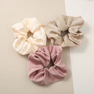 Three-piece large satin scrunchies set in beige, champagne and pink silk-like fabric