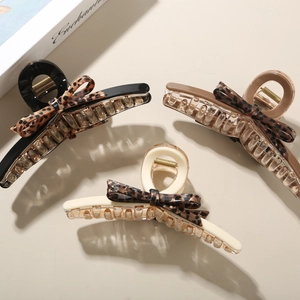 Three-piece set of leopard print bow hair claws in black, brown, and cream colors