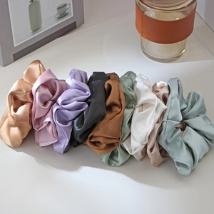 Elegant satin silk scrunchies set in nine Morandi colors on a clean white background